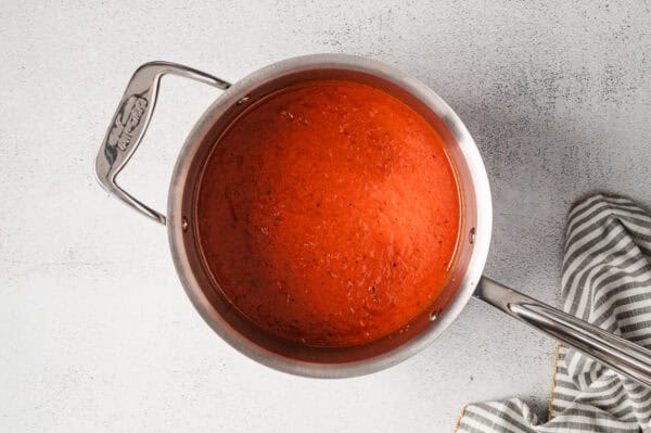 Roasted red pepper soup in a pot.