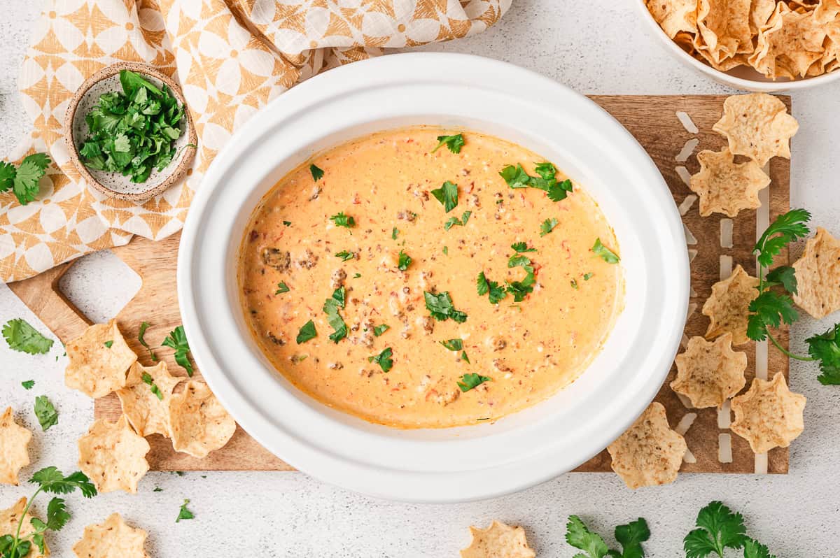 Overhead view of a crockpot of Rotel and sausage cheese dip