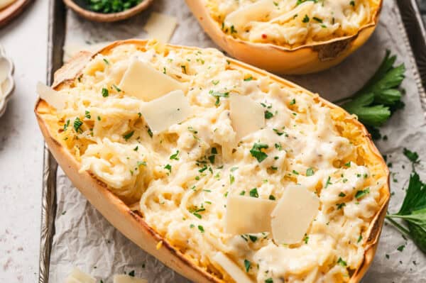 cut half roasted spaghetti squash with alfredo sauce