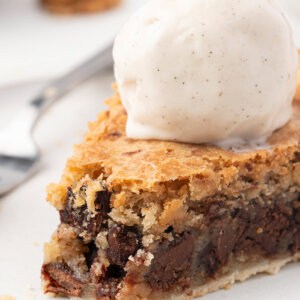 slice of Easy Chocolate Chip Cookie Pie with a scoop of vanilla ice cream