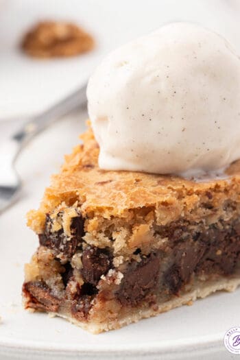 slice of Easy Chocolate Chip Cookie Pie with a scoop of vanilla ice cream