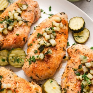 Dill pickel chicken on a white platter