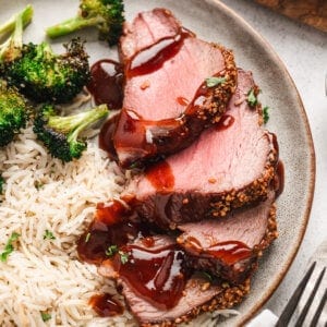 sliced roasted Tri-Tip on plate with sauce