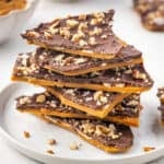 A stack of toffee bark on a white plate