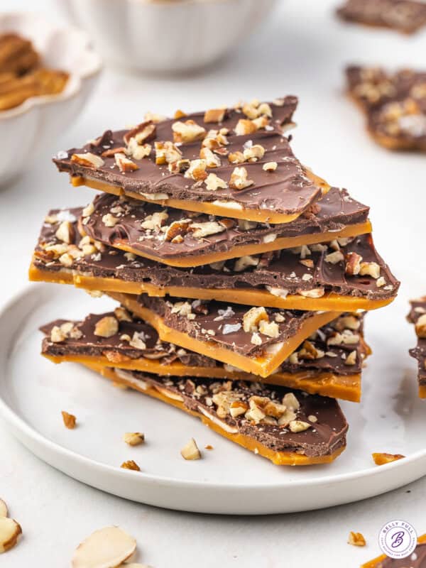 A stack of toffee bark on a white plate
