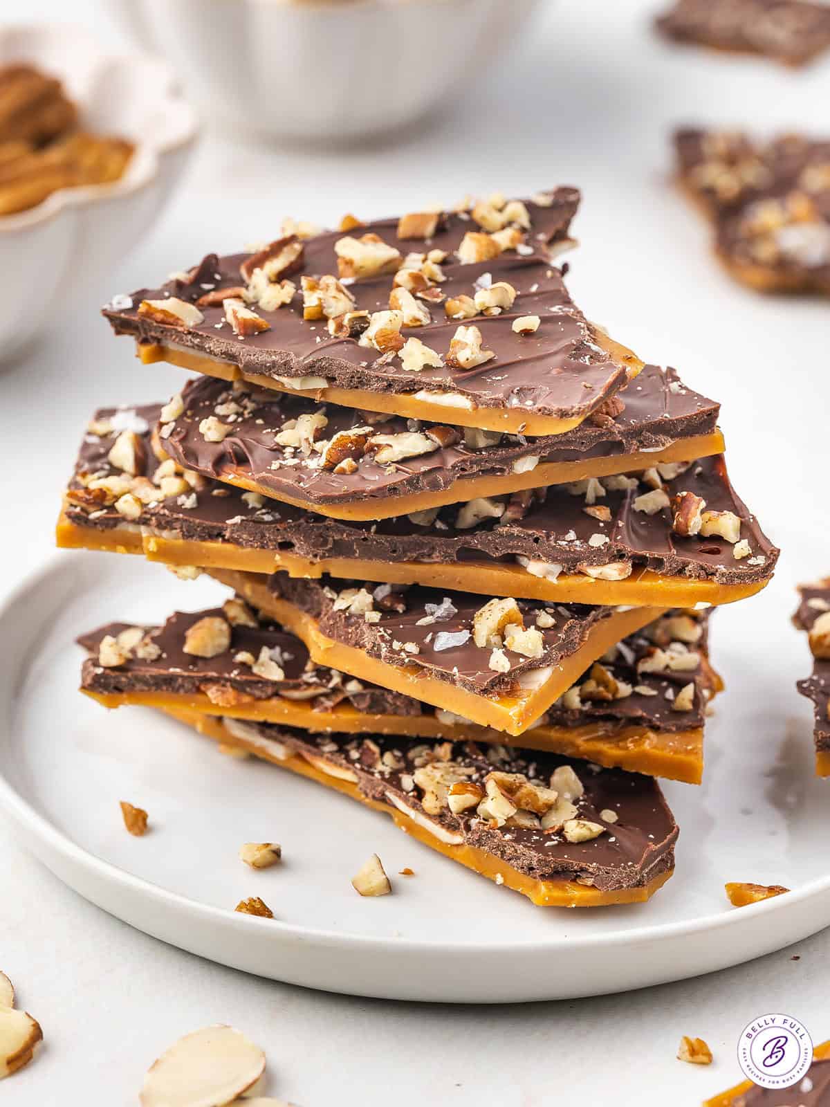 A stack of toffee bark on a white plate