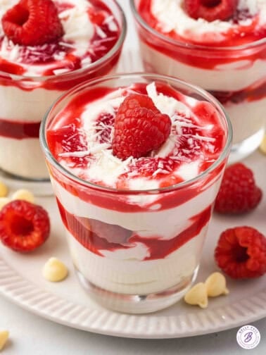 white chocolate cheesecake raspberry parfaits toped with fresh raspberry