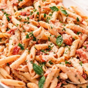 A plate of creamy penne with tomatoes