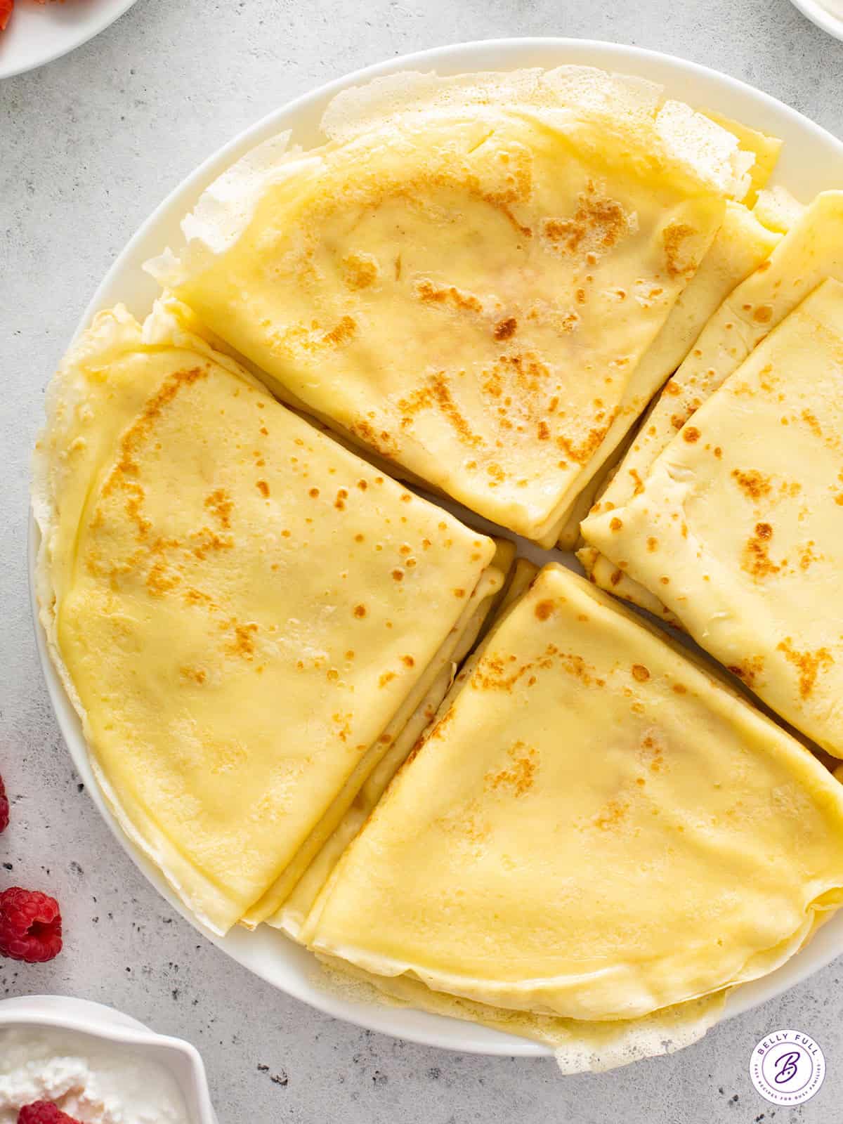 4 stacks of folded crepes on plate