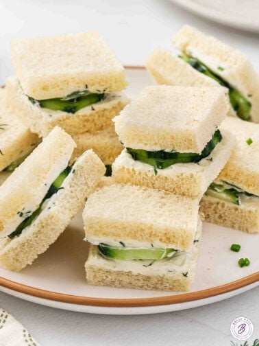 Plate of stacked cucumber tea sandwiches