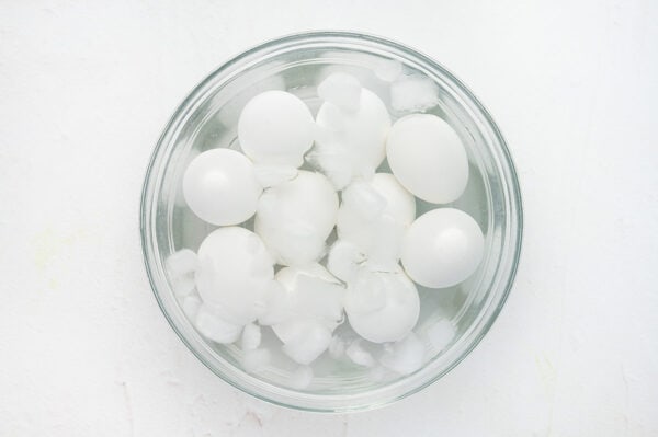 hard boiled eggs in bowl of ice water