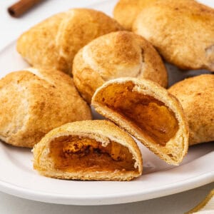 A plate of resurrection rolls, one cut in half to show the inside.