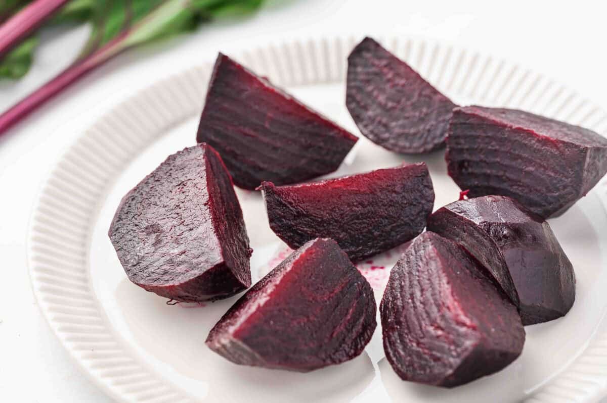 roasted beets cut into wedges on plate