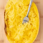 Half of a spaghetti squash roasted with pulled strands