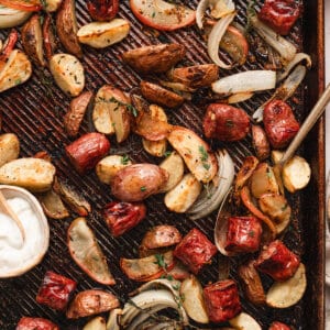 Overhead view of sheet pan potato, apple, and sausage