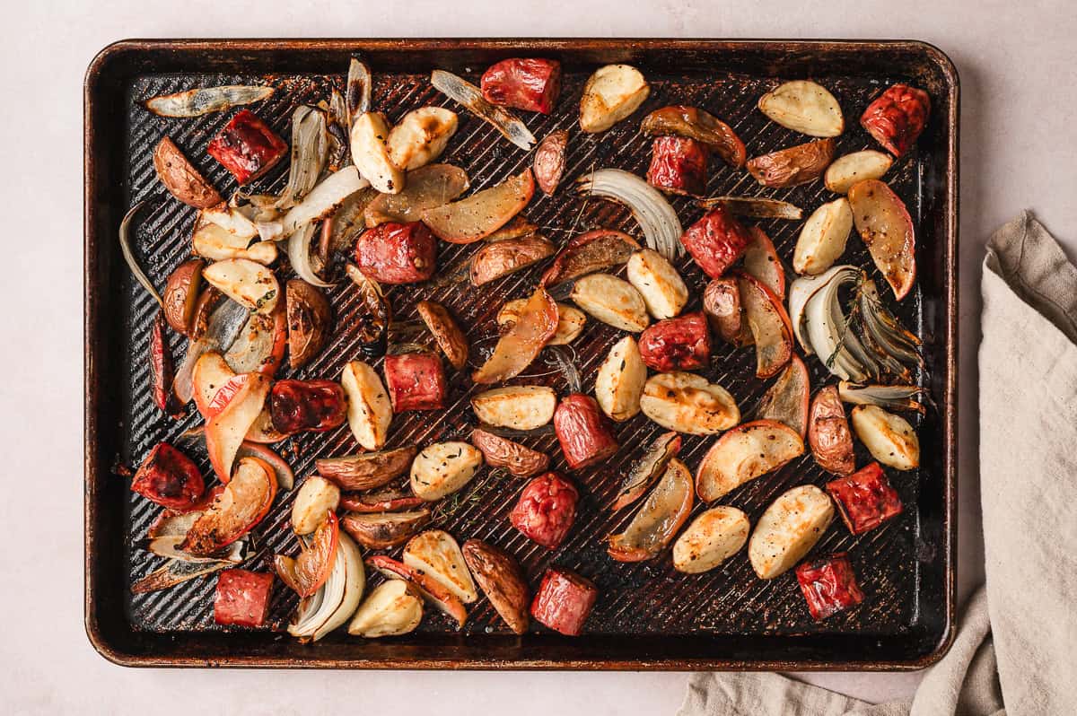 Overhead view of sheet pan potato, apple, and sausage