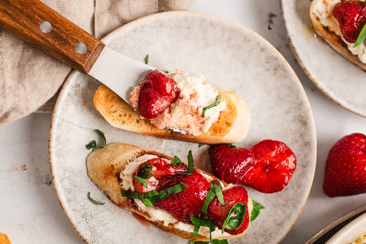 whipped feta on crostini with glazed strawberries
