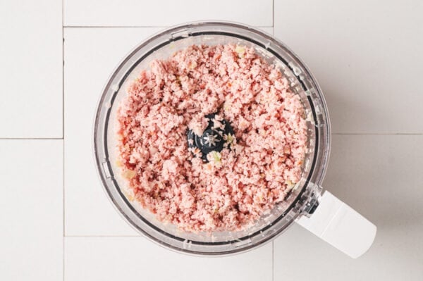 minced ham in bowl of food processor
