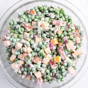 overhead pea salad in glass bowl