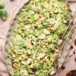 Overhead view of shaved brussels sprouts salad on a platter
