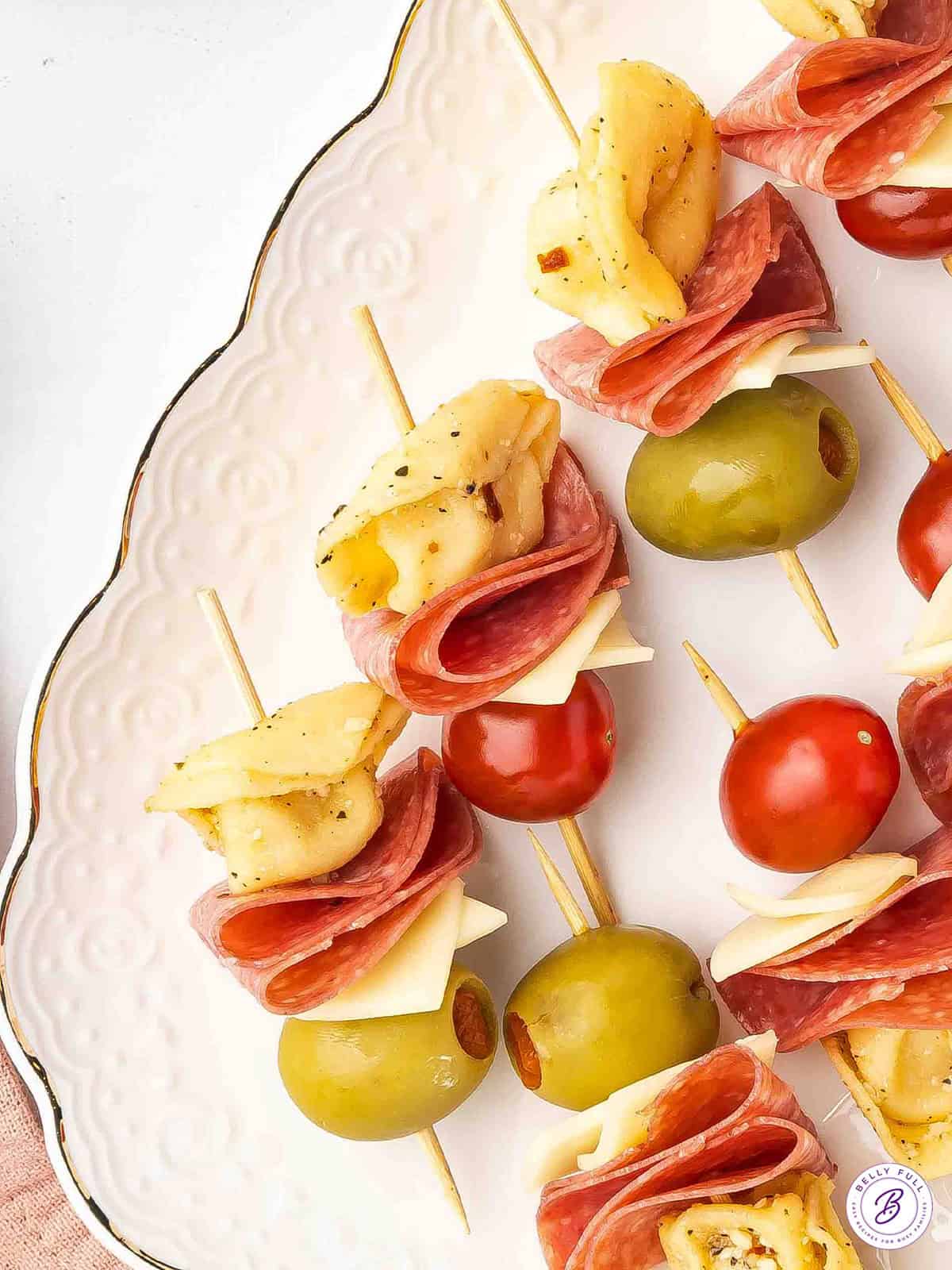 Mini Tortellini Kabobs with salami, cherry tomatoes, and cheese on party skewers