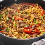 A skillet of Mongolian beef noodles