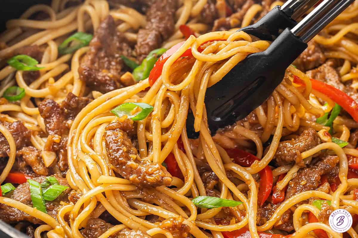 Tongs serving Mongolian beef noodles