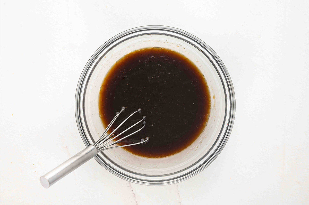 Whisking the sauce ingredients together