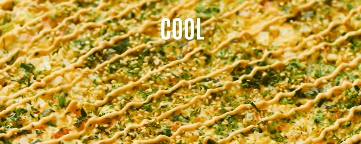 Spicy mayo drizzled over the baked sushi bake.