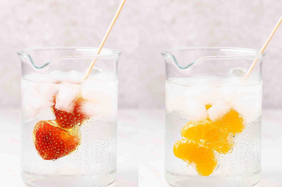 Dipping tanghulu in a glass of ice water
