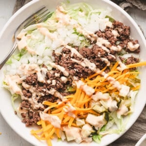 overhead Low Carb Big Mac Salad drizzled with sauce