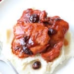 2 pieces of cranberry chicken over mashed potatoes