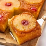Serving a slice of pineapple upside down cake