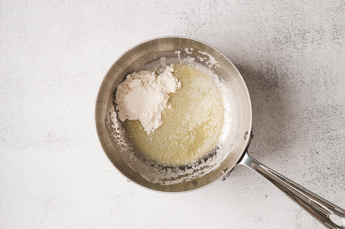 Butter melting in a saucepan over medium heat.
