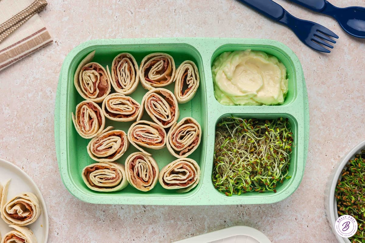 Bento box with BLT pinwheels and mayo