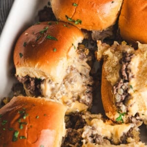 close up baked chopped cheeseburger sliders