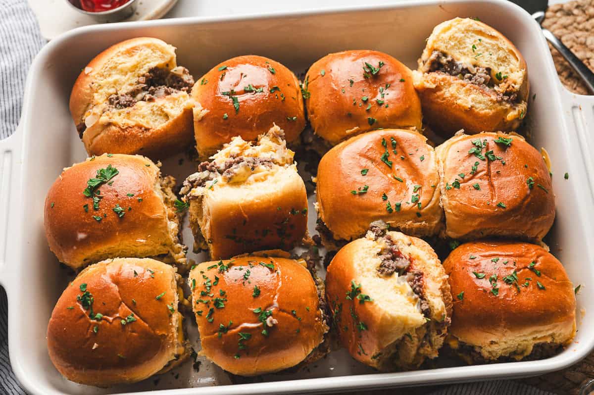 baked chopped cheeseburger sliders in casserole dish
