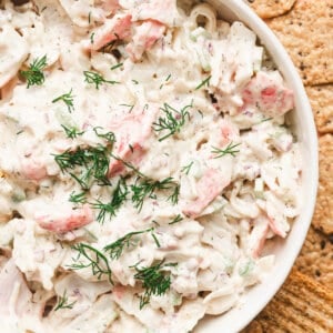 overhead dish of crab salad garnished with fresh chopped dill