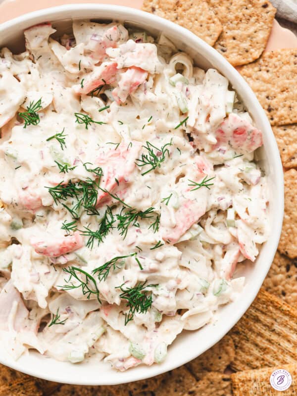 overhead dish of crab salad garnished with fresh chopped dill