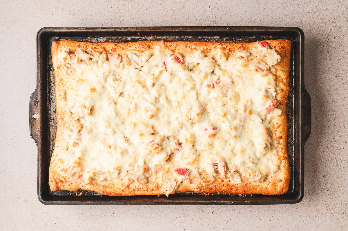 Golden baked crab rangoon pizza fresh from the oven with bubbly melted cheese.