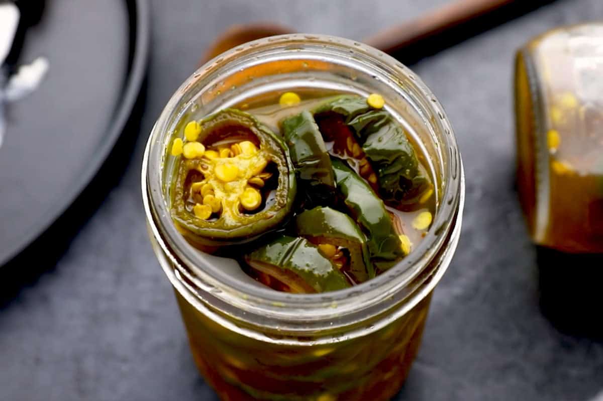 overhead Candied Jalapeños (aka Cowboy Candy) in glass jar