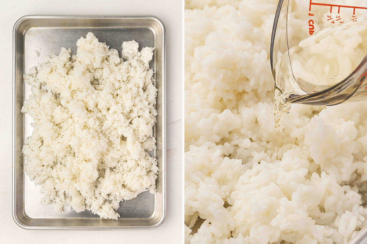 Cooked sushi rice spread on a baking sheet with rice vinegar mixture being poured over the top.