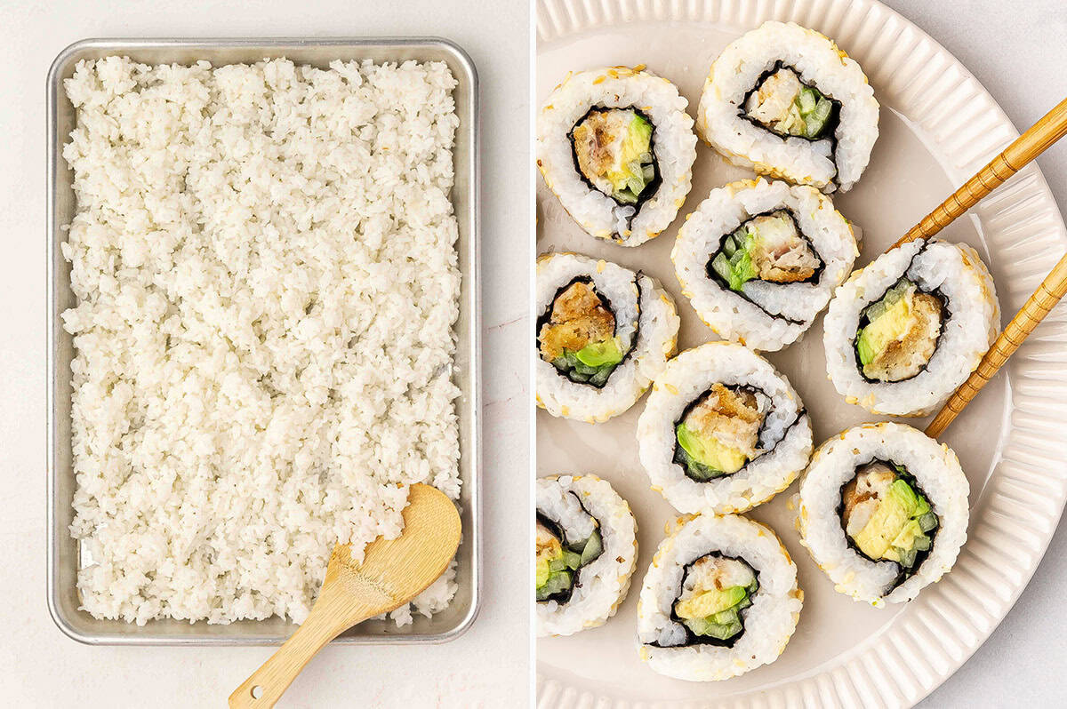 Seasoned sushi rice spread evenly on a tray next to homemade sushi rolls filled with avocado and fried fish.