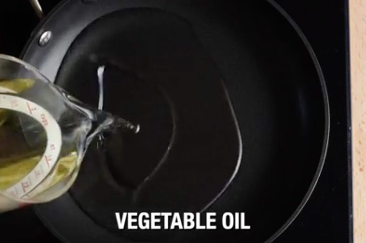 vegetable oil being poured in deep pan