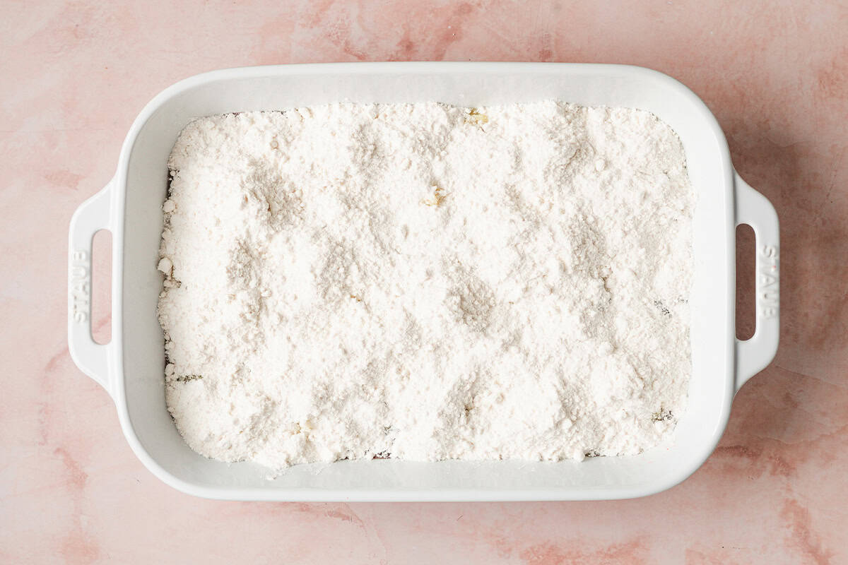 yellow cake mix covering a 9x13 casserole dish