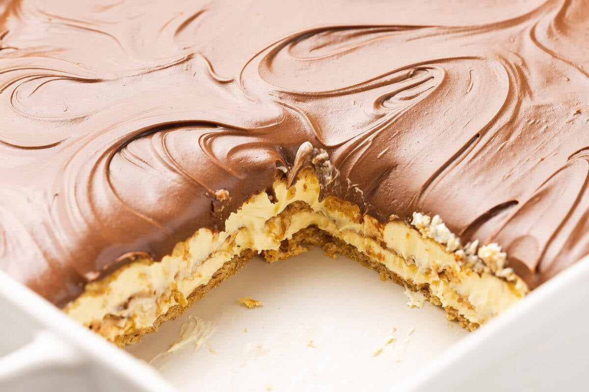 sliced No-Bake Chocolate Eclair Cake in casserole dish