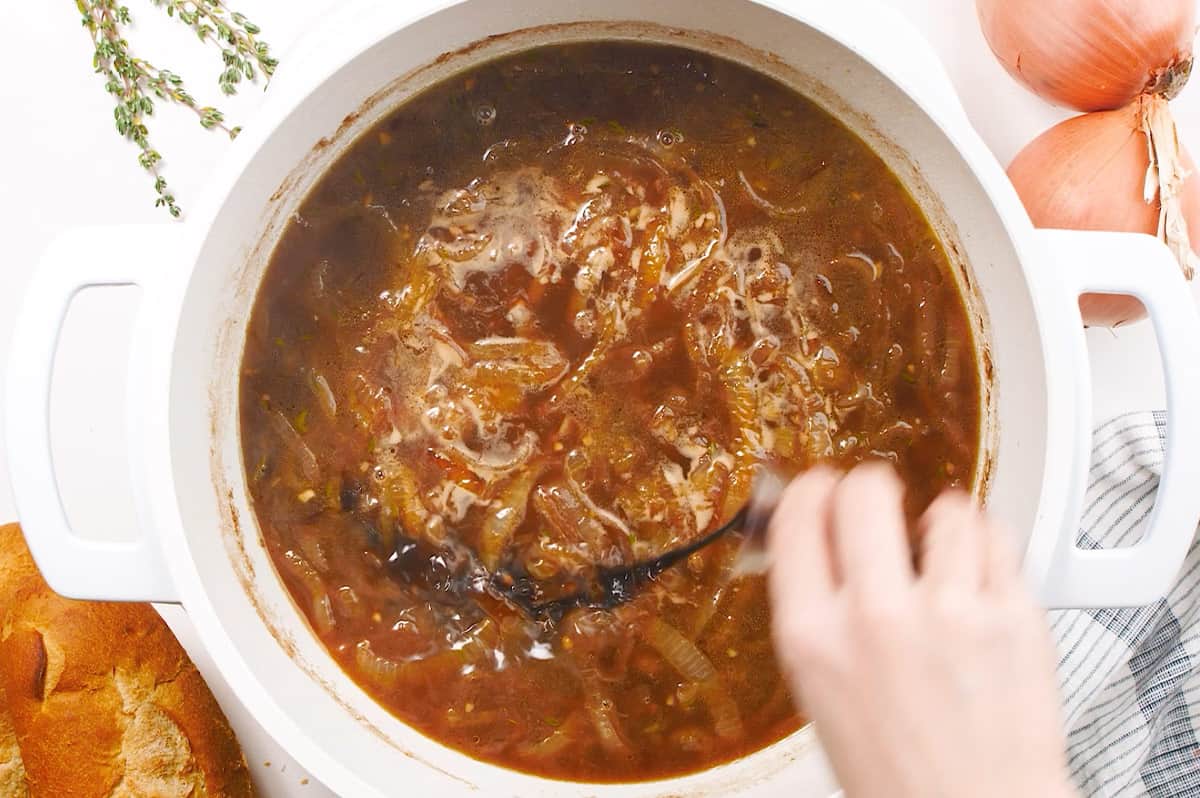 balsamic vinegar being added to french onion soup