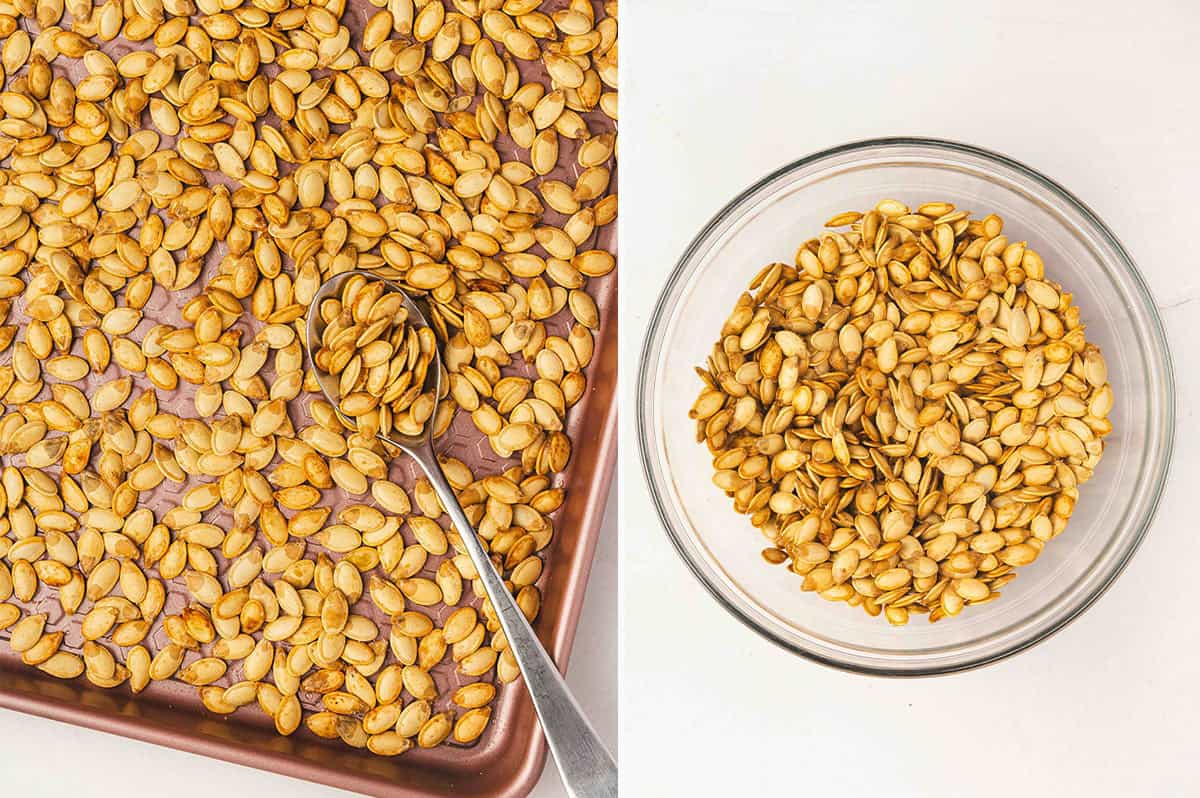 Toasted pumpkin seeds being stirred on a baking sheet with a spoon, showing crisp texture