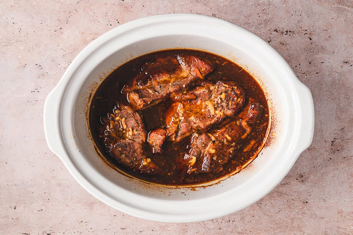 Slow cooked pork ribs simmered in orange marmalade hoisin sauce after cooking, tender and ready to serve