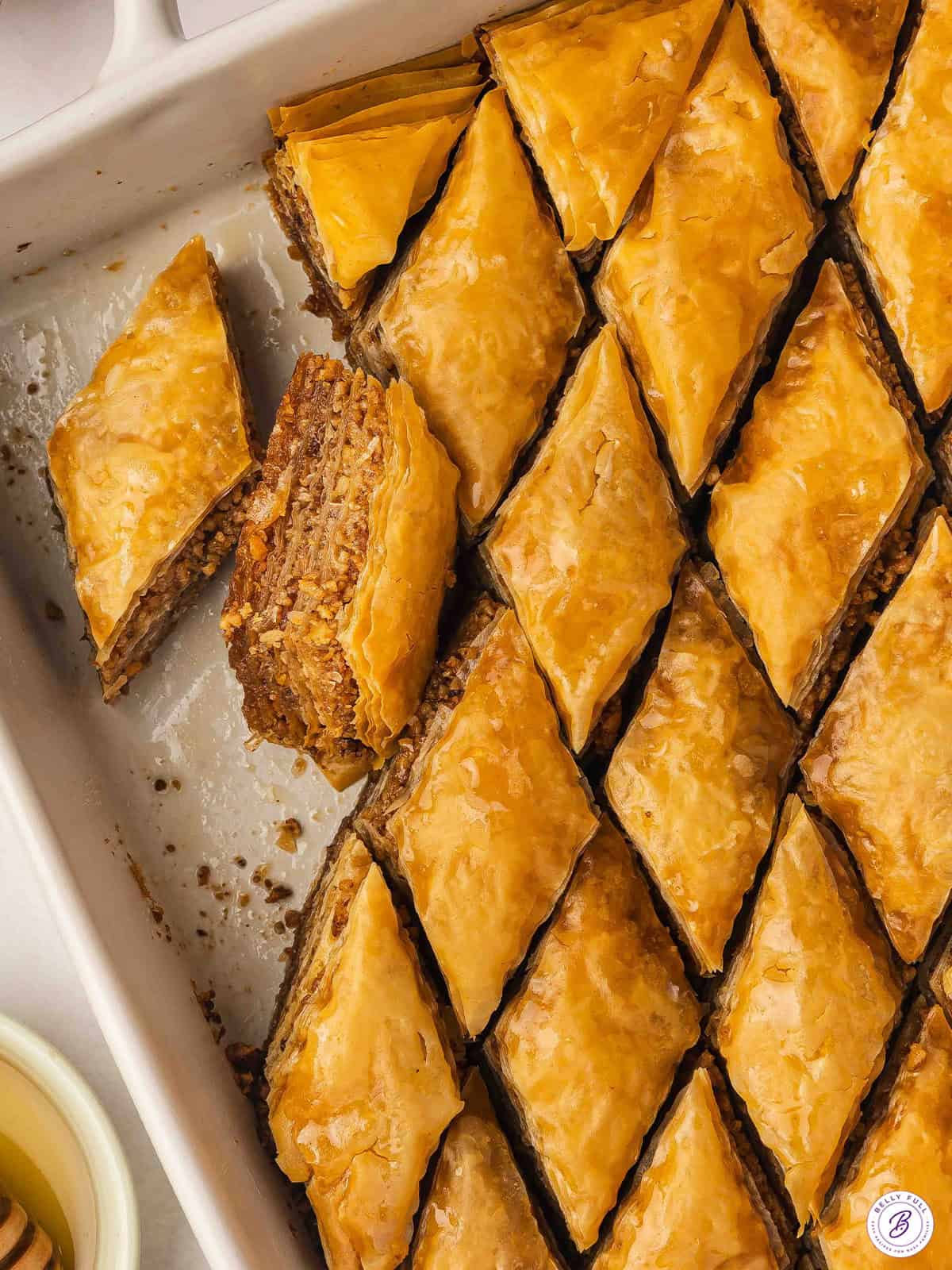 Baklava cut into triangles in pan